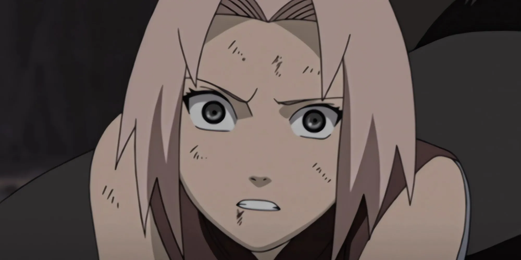 Sakura Haruno với biểu cảm không vui, thường xuyên bị chỉ trích vì sự ám ảnh với Sasuke