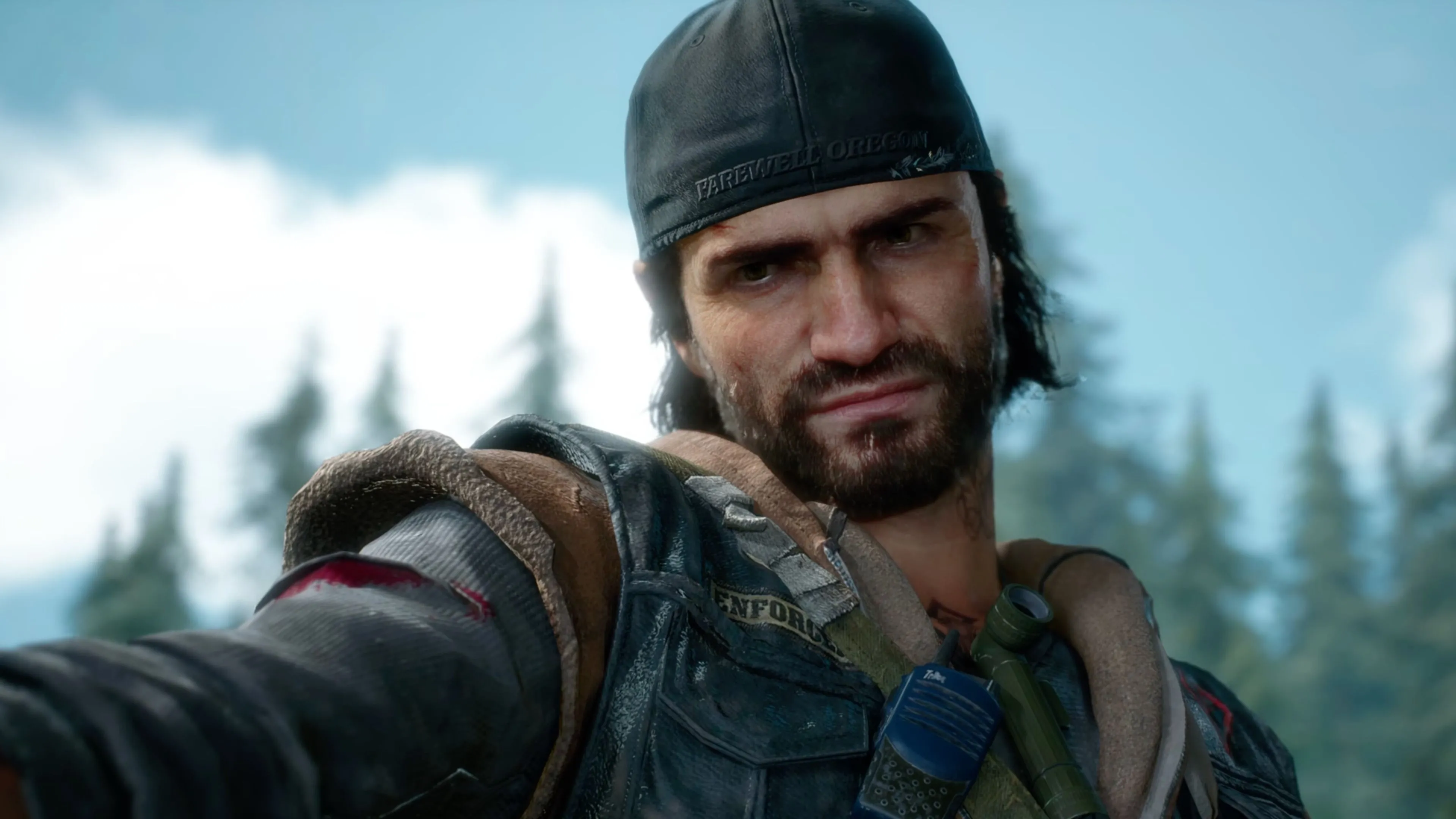 Hình ảnh Deacon St. John cưỡi mô tô vào ban đêm trong thế giới Days Gone Remastered