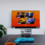 Hệ thống súng light gun G'aim'e Plug & Play đặt trước màn hình TV hiện đại.