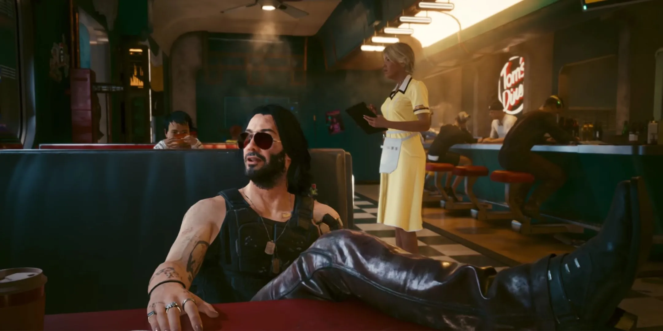 Johnny Silverhand ngồi trong quán ăn trong Cyberpunk 2077: Ultimate Edition trên Nintendo Switch 2, minh họa một bản port thành công.