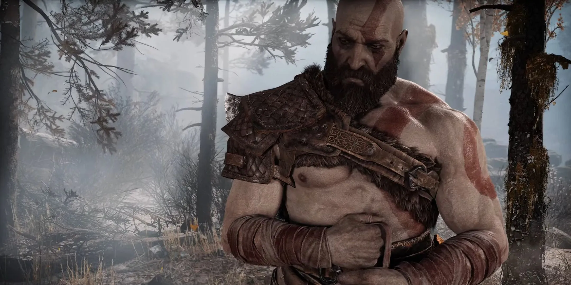 Kratos trong God of War (2018) với ánh mắt trầm tư và bộ râu dày