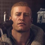 Rip Blazkowicz ngồi với hai khẩu súng chĩa vào đầu, ánh mắt vô hồn