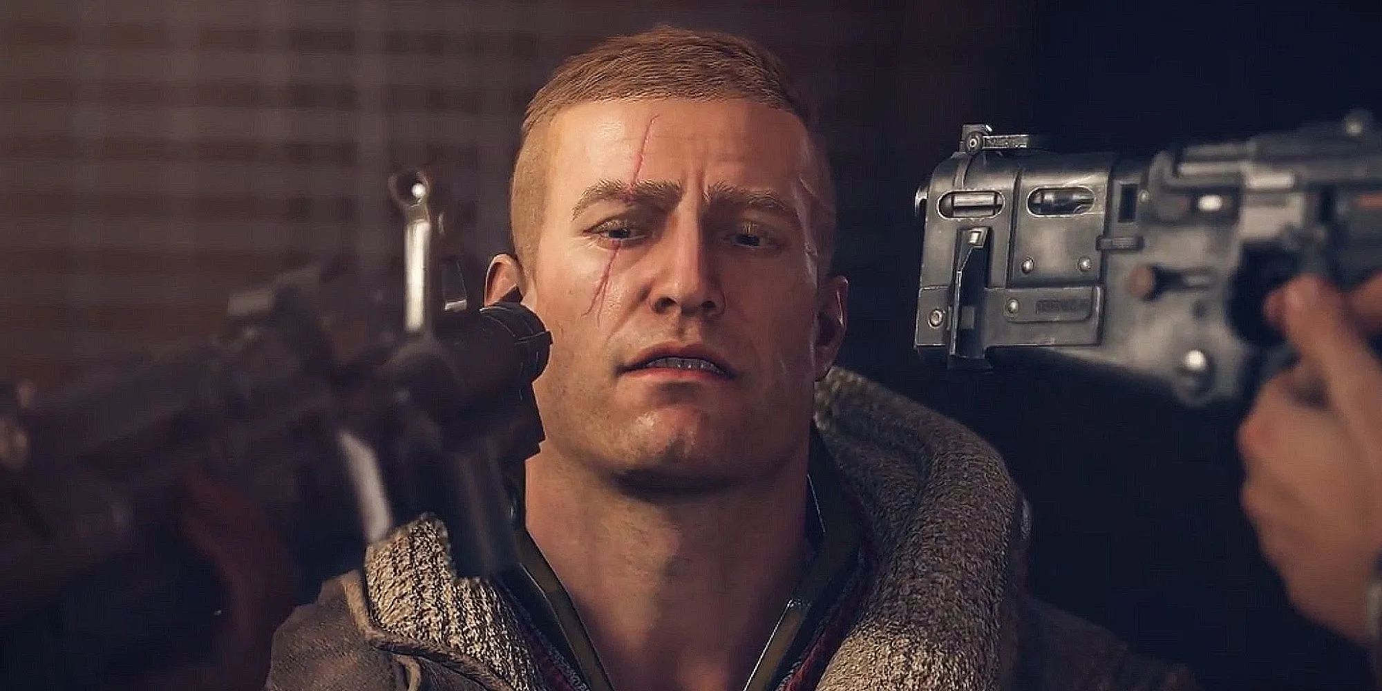 Rip Blazkowicz ngồi với hai khẩu súng chĩa vào đầu, ánh mắt vô hồn