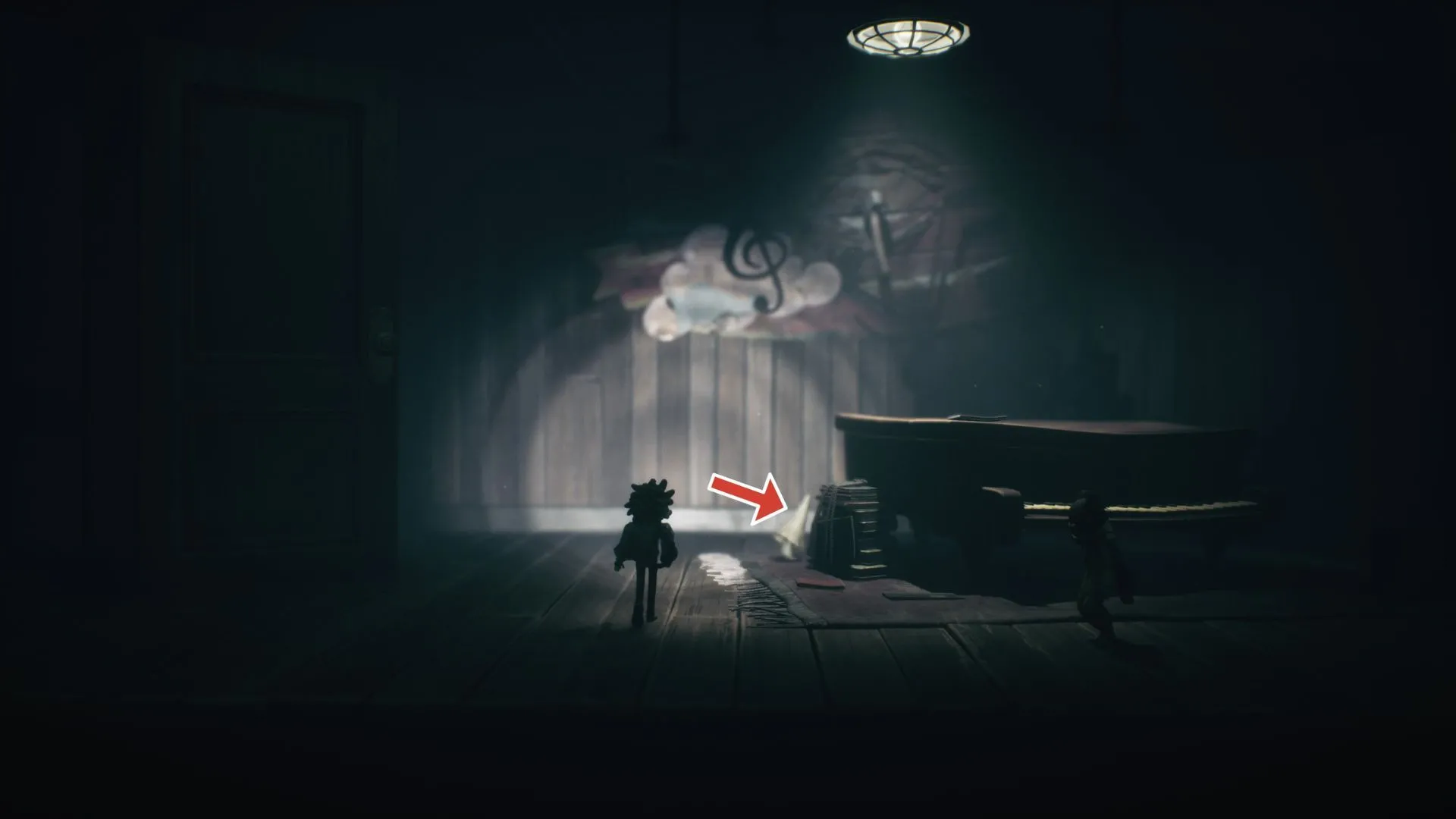 Nome thứ năm trốn sau piano sau khi mở cửa bí mật Little Nightmares 3